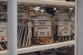 Gourmet dog treats in jars in a window of a shop in Broadway, Cotswolds, UK