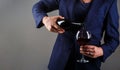 Gourmet drink bottle, red wine glass, sommelier, tasting. Waiter pouring red wine in a glass. Sommelier man, degustation Royalty Free Stock Photo