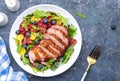 Gourmet duck salad with grilled breast with red orange, kumquat, blueberry and swiss chard, lettuce and arugula leaves on blue Royalty Free Stock Photo