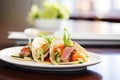 gourmet duck tacos with hoisin sauce and green onions, elegant plating