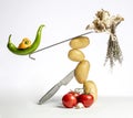 Gourmet food composition with vegetables and kitchen utensils