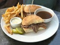 Gourmet French Dip Style Sandwich with Au Jus Sauce and Fries