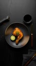 Gourmet Fried Chicken Leg Dinner on Dark Table Setting Royalty Free Stock Photo