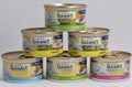 Gourmet Gold pet food cans on white background Royalty Free Stock Photo