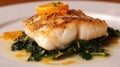 Gourmet grilled fish with citrus garnish on a bed of sauteed spinach Royalty Free Stock Photo