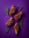 Gourmet Grilled Lamb Chops with Fresh Rosemary on a Rich Purple Background for Fine Dining Royalty Free Stock Photo