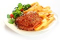 Gourmet Grilled Meat with French Fries on Plate Royalty Free Stock Photo