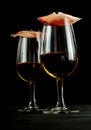 Gourmet ham balanced on glasses of Spanish sherry Royalty Free Stock Photo