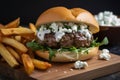 Gourmet lamb burger with arugula, feta cheese, and tzatziki sauce on a freshly baked ciabatta bun, served with garlic fries