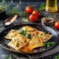 Gourmet Lobster Ravioli with Fresh Herbs and Tomato Garnish Royalty Free Stock Photo