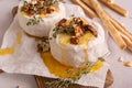 Brie or camembert cheese with thyme, nuts, honey and grissini breadstick Royalty Free Stock Photo