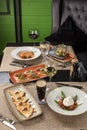 Gourmet meals assorted set appetizer tartare, barrata, pasta on the table Buffet at restaurant
