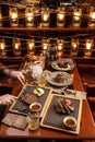 Gourmet meals assorted set on wooden table Buffet man eating steak at restaurant Royalty Free Stock Photo