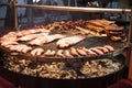 Gourmet meat pieces pork ribs, sausages, on a large grill . Royalty Free Stock Photo