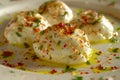 Gourmet Mediterranean Cuisine Labneh Cheese Balls with Olive Oil and Herbs on a Plate