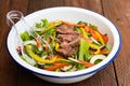 Gourmet mixed garden salad with red onion, bell peppers, zucchini and steak Royalty Free Stock Photo