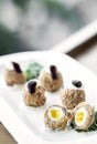 Gourmet organic scotch quail eggs starter snack on table Royalty Free Stock Photo