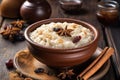 Gourmet photo of rice pudding garnish with anise and cinnamon rolls