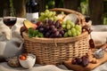 gourmet picnic basket filled with wine, cheese, and fresh fruit Royalty Free Stock Photo