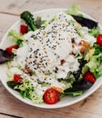 Gourmet plate of Caesar salad with chicken, parmesan, and crusty bread Royalty Free Stock Photo