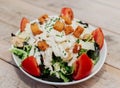 Gourmet plate of Caesar salad with chicken, parmesan, and crusty bread Royalty Free Stock Photo