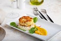 Gourmet plated fishcake with vegetables Royalty Free Stock Photo