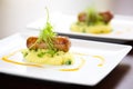 gourmet plating of bangers and mash with chives