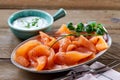 Gourmet platter of fresh smoked salmon with herbs