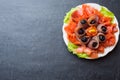 Gourmet restaurant serving a plate of smoked salt, raw white fish fillets and salmon. Delicacy fresh seafood dish with catfish, Royalty Free Stock Photo