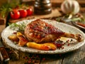 Gourmet Roasted Chicken Leg on Decorative Plate with Grilled Vegetables, Herbs and Spices on Rustic Wooden Table Rustic Home