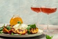 Gourmet Roasted Peaches with Burrata soft cheese, basil and drizzled with honey, with rose wine. Antipasto Dinner or aperitivo