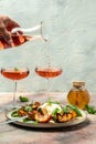 Gourmet Roasted Peaches with Burrata soft cheese, basil and drizzled with honey, with rose wine. Antipasto Dinner or aperitivo