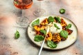 Gourmet Roasted Peaches with Burrata soft cheese, basil and drizzled with honey, with rose wine. Antipasto Dinner or aperitivo