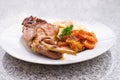 Gourmet roasted rabbit leg with glazed sweet carrot and baked potatoes choped on thin slices. Royalty Free Stock Photo