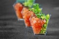 Gourmet salad with avocado and tomatoes on a gray background. Concept for food, diet and healthy food, restaurant and catering Royalty Free Stock Photo