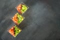 Gourmet salad with avocado and tomatoes on a gray background. Top view. Concept for food, diet and healthy food, restaurant and