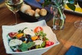 Gourmet salad on black stone background. Dark food photography