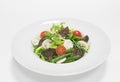 Gourmet salad with eggplant, cherry tomatoes, green beans and champignons. Top view. White background. Healthy eating concept