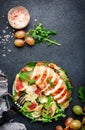 Gourmet salad with fresh figs, grilled chicken, parmesan cheese, grape, arugula, swiss chard with wine vinegar dressing. Black Royalty Free Stock Photo