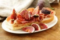 Gourmet sandwich with smoked ham (Parma) and figs