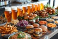 Gourmet slider buffet with a variety of burgers, fries, and beer sampler on a bar counter Royalty Free Stock Photo