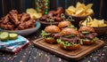 Gourmet sliders and appetizers on wooden table with colorful confetti Royalty Free Stock Photo