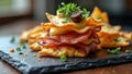 Gourmet snack stack with cured meat, cheese, and olives on slate Royalty Free Stock Photo