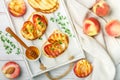 Gourmet summer Breakfast - sandwiches bread toast, bruschetta with grilled peaches Royalty Free Stock Photo