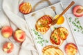 Gourmet summer Breakfast - sandwiches bread toast, bruschetta with grilled peaches Royalty Free Stock Photo