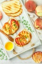 Gourmet summer Breakfast - sandwiches bread toast, bruschetta with grilled peaches Royalty Free Stock Photo