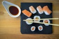 Gourmet, Sushi on a wooden table on black slate plate with soy s