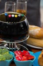 Gourmet Swiss fondue dinner with assorted cheeses and a heated pot of cheese fondue with a fork dipping and some Royalty Free Stock Photo
