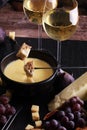 Gourmet Swiss fondue dinner on a winter evening with assorted ch Royalty Free Stock Photo