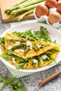 Gourmet Tasty Egg Omelette with Asparagus and soft Cheese. Asparagus. Fresh Asparagus with eggs Royalty Free Stock Photo